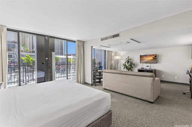 a view of entryway with wooden floor and cabinet