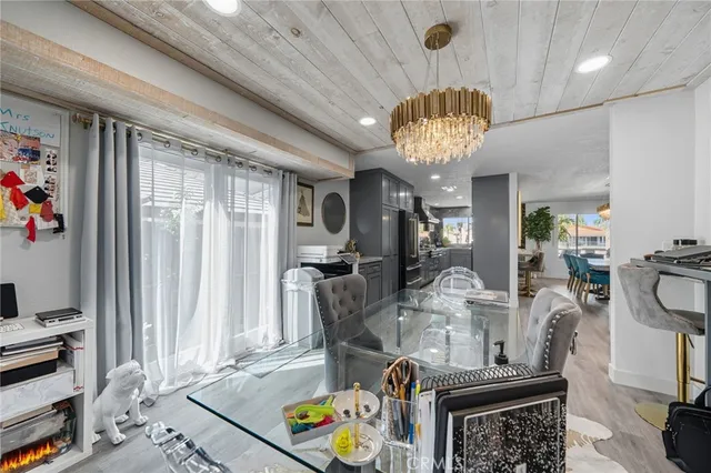 a dining room with furniture and wooden floor