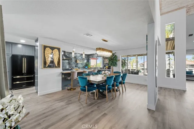 a view of a dining room with furniture and wooden floor
