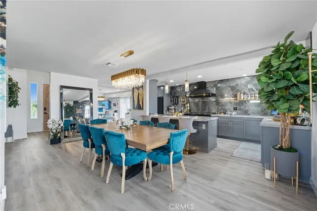 a kitchen with a sink cabinets and chair