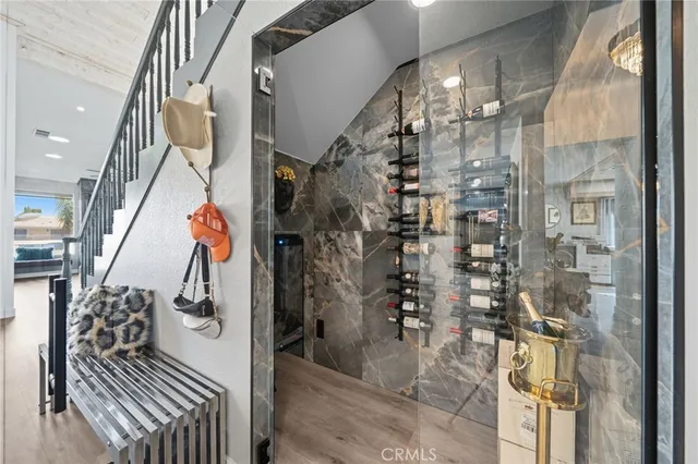 a dining room with furniture a rug and a chandelier