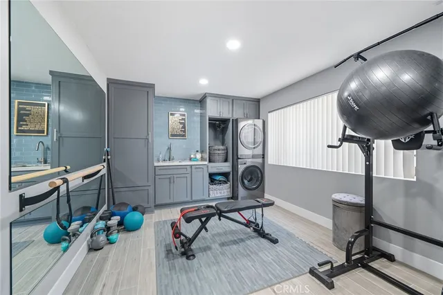 a view of a hallway with wooden floor and stairs