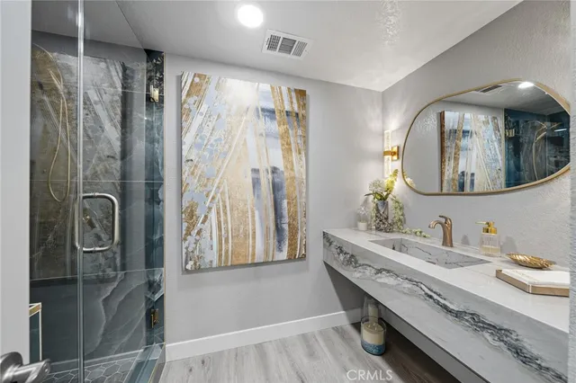 a spacious bedroom with a large bed and a flat screen tv