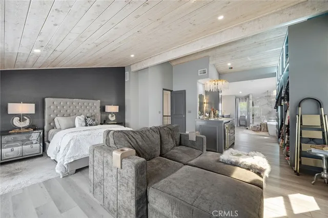 a bedroom with a bed and a mirror