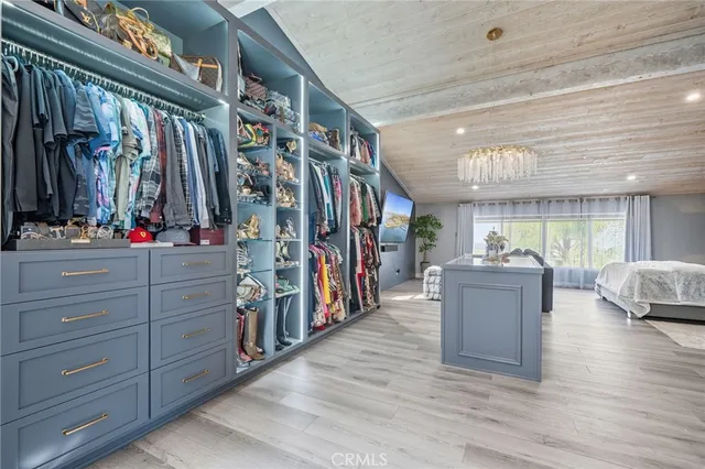 a bedroom with a bed couch and window