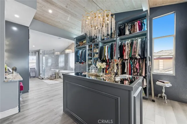a bathroom with a granite countertop sink a toilet a mirror and shower