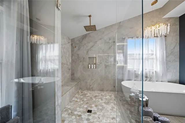 a view of a swimming pool and outdoor seating