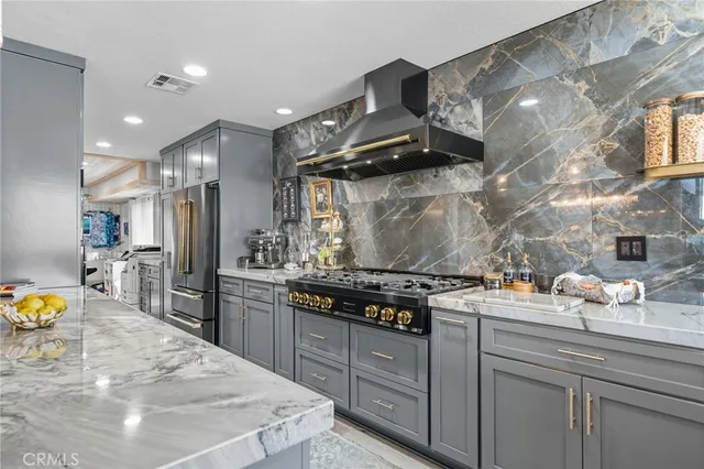 a kitchen with sink stove and cabinets