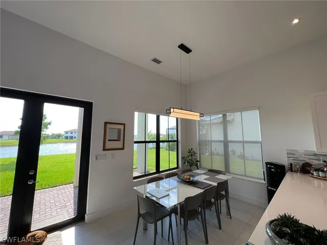 a view of a dining room with furniture window and outside view