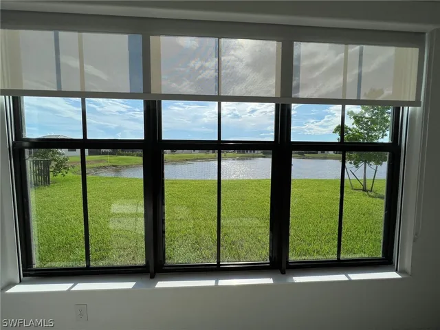 a view of a room with a large window