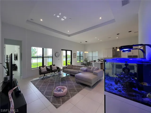 a living room with furniture a couch and a fireplace