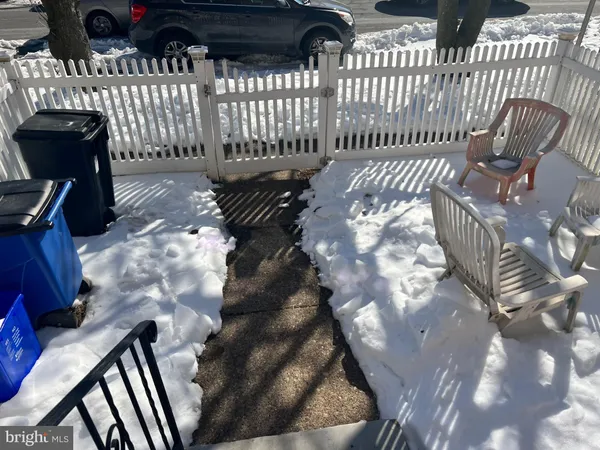 a view of a porch with wooden fence