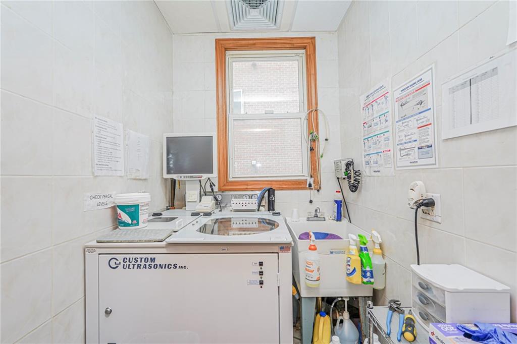 237 Bay Ridge Parkway Brooklyn, NY 11209 - Photo 12 of 30 a utility room with a sink dryer and washer