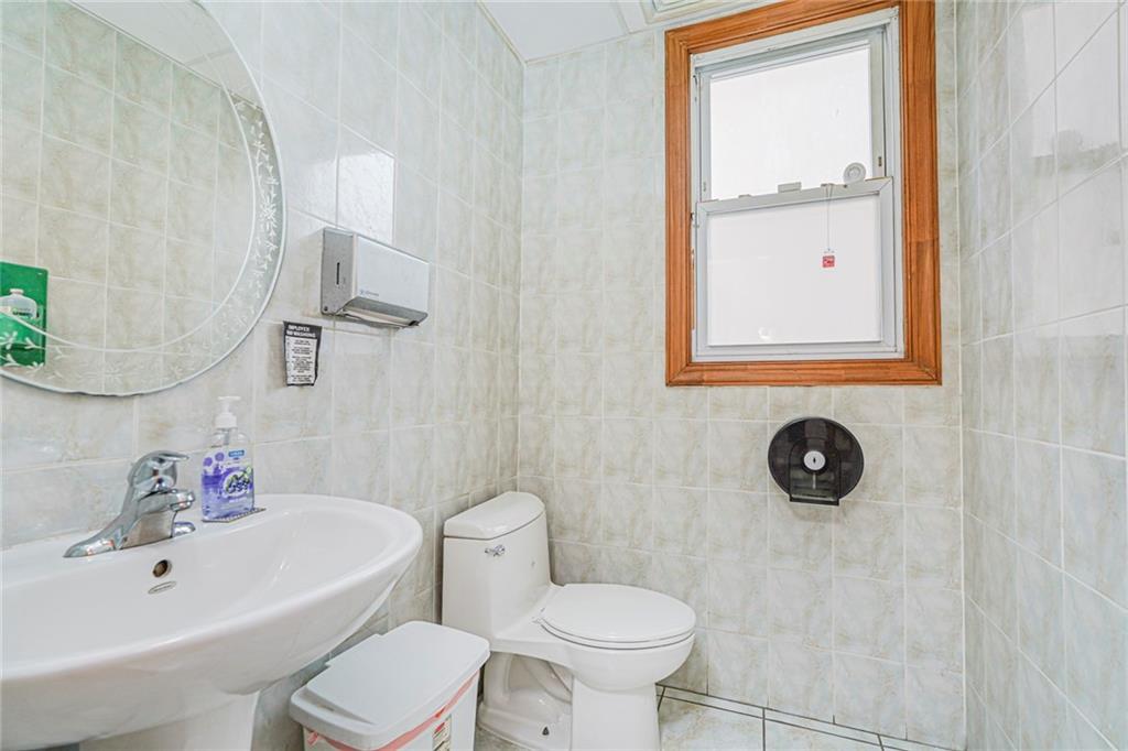 237 Bay Ridge Parkway Brooklyn, NY 11209 - Photo 13 of 30 a bathroom with a sink mirror toilet and bathtub