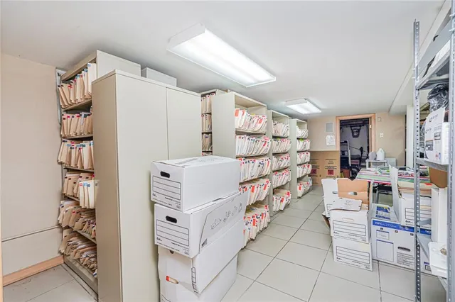 a bedroom with furniture and white walls