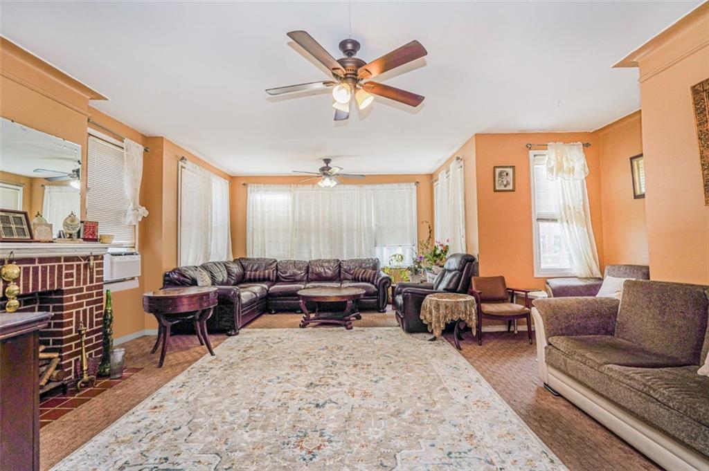 237 Bay Ridge Parkway Brooklyn, NY 11209 - Photo 16 of 30 a living room with furniture and large windows