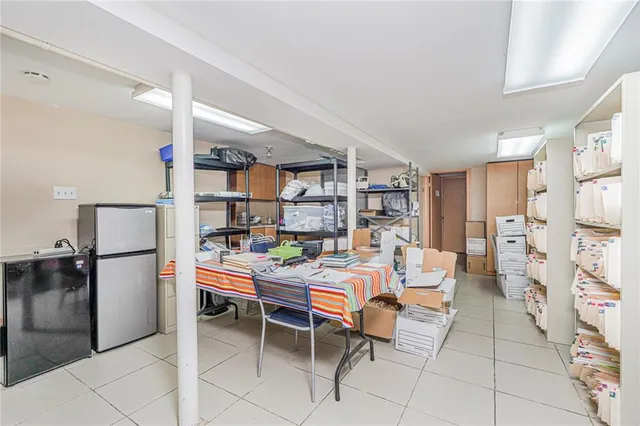 a room with furniture a washer and dryer