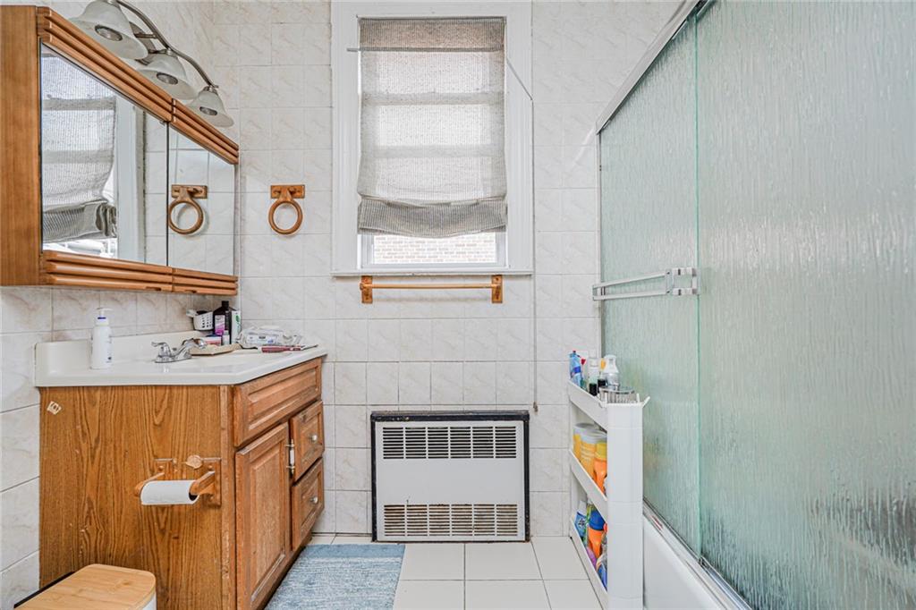 237 Bay Ridge Parkway Brooklyn, NY 11209 - Photo 21 of 30 a bathroom with a sink a toilet and shower