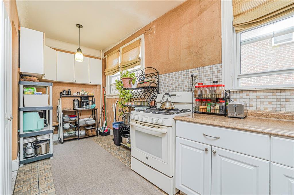 237 Bay Ridge Parkway Brooklyn, NY 11209 - Photo 24 of 30 a kitchen with cabinets and window