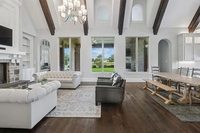 a living room with furniture fireplace and flat screen tv