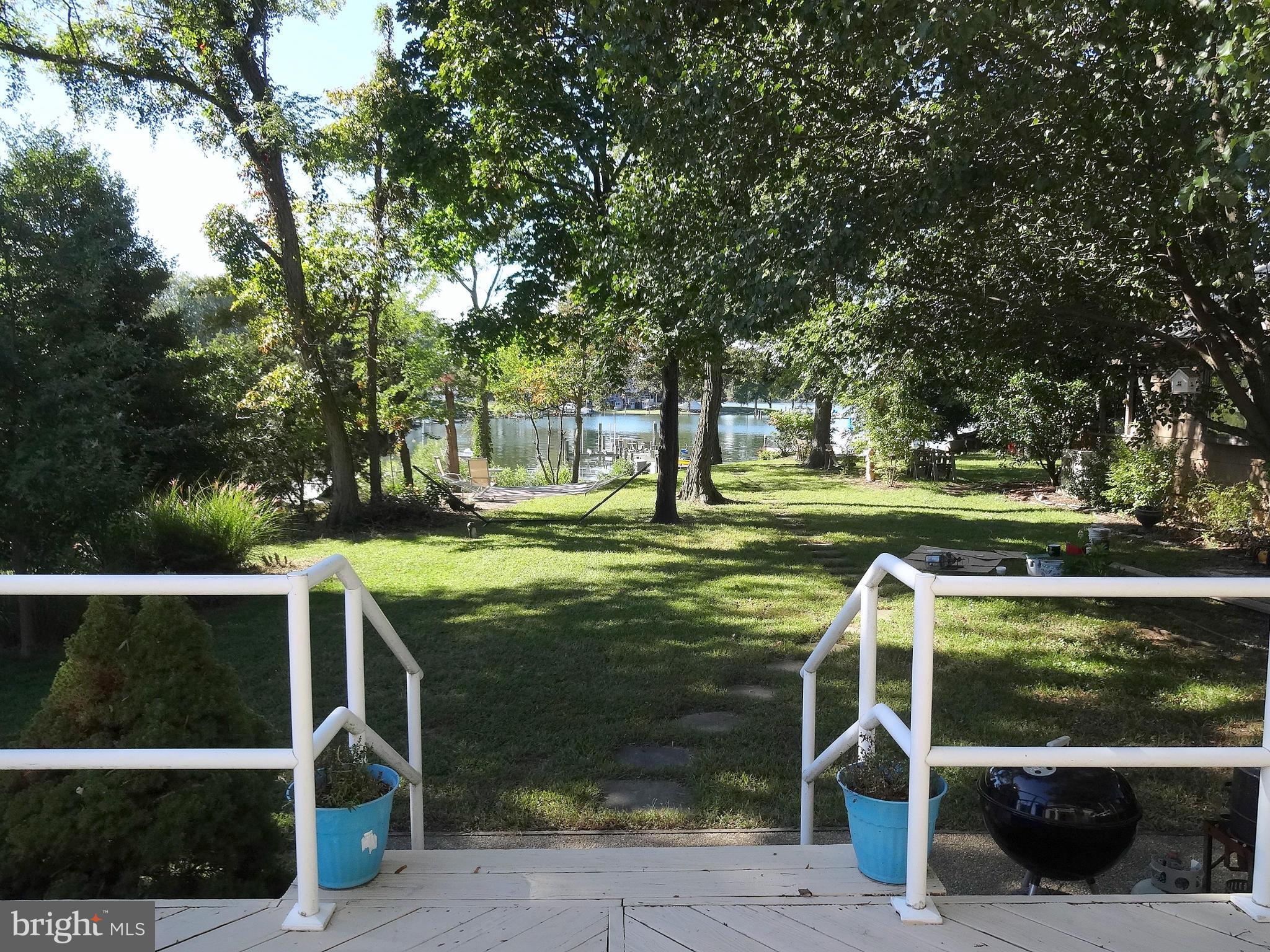 8096 Ventnor Road Pasadena, MD 21122 - Photo 26 of 30 Walking across huge Deck off of Great Room