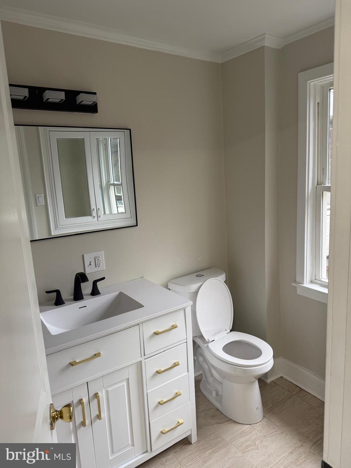 334 Church Road, Unit 2 Elkins Park, PA 19027 - Photo 13 of 38 a bathroom with a toilet sink and mirror