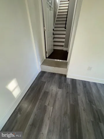 a view of entryway with wooden floor
