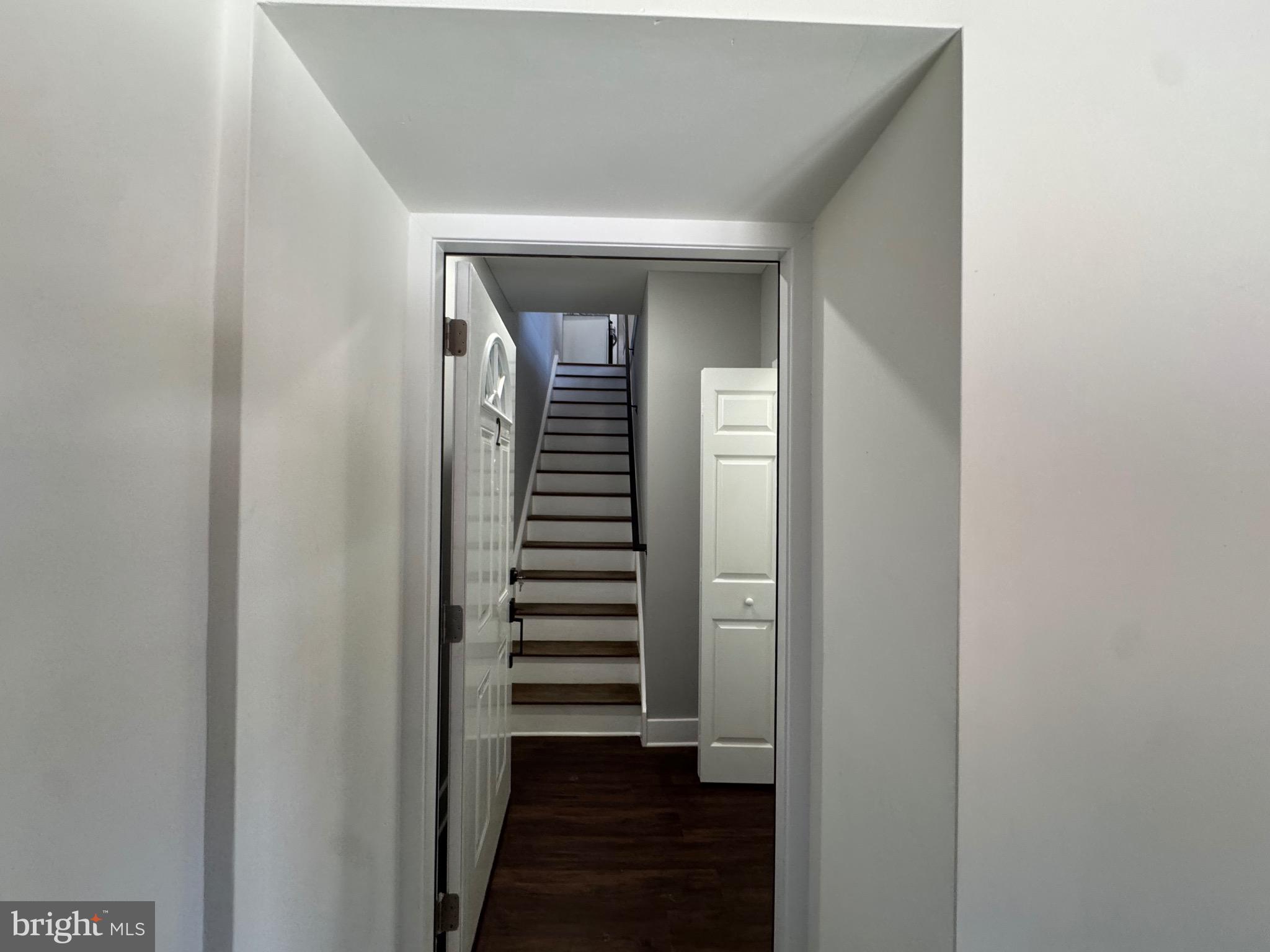 334 Church Road, Unit 2 Elkins Park, PA 19027 - Photo 21 of 38 a view of a hallway with stairs and wooden floor