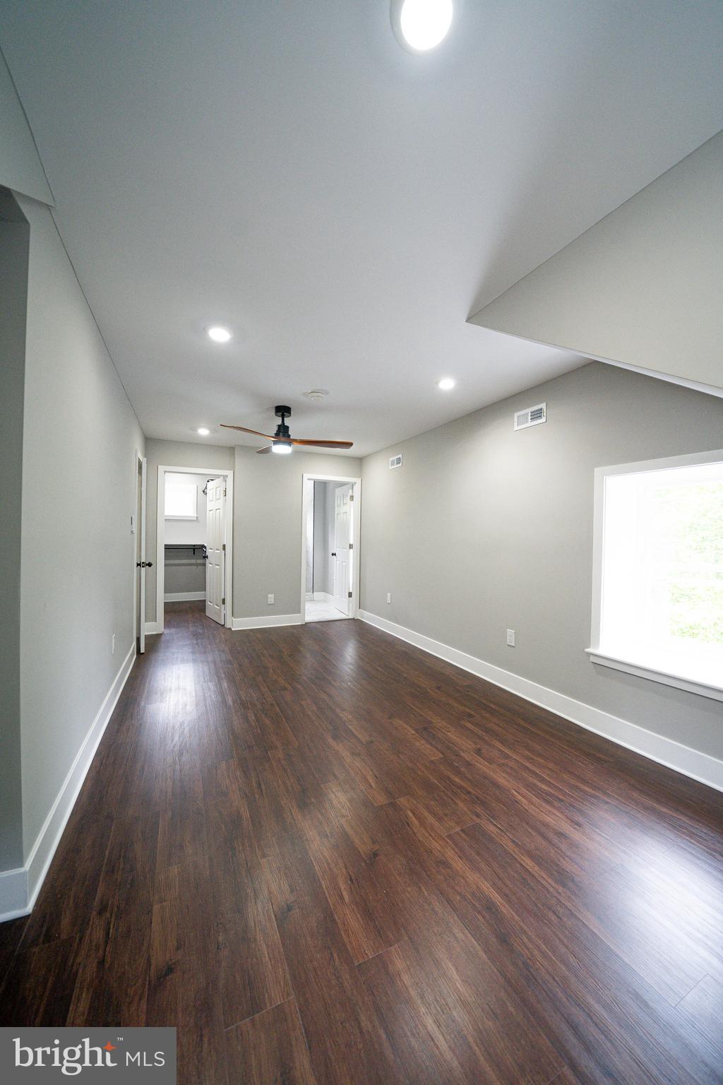 334 Church Road, Unit 2 Elkins Park, PA 19027 - Photo 30 of 38 an empty room with wooden floor and windows