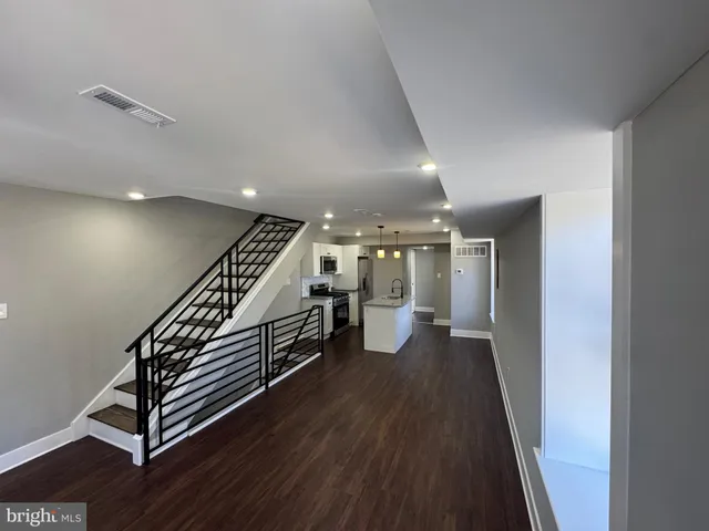 a view of an entryway with wooden floor