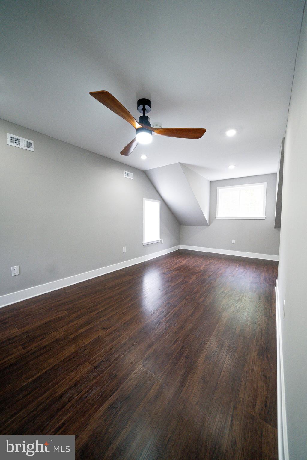 334 Church Road, Unit 2 Elkins Park, PA 19027 - Photo 31 of 38 an empty room with wooden floor and windows