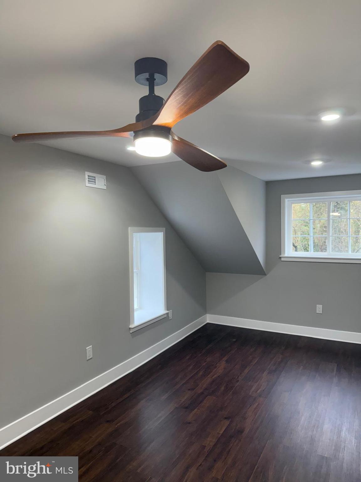 334 Church Road, Unit 2 Elkins Park, PA 19027 - Photo 10 of 38 an empty room with wooden floor and windows