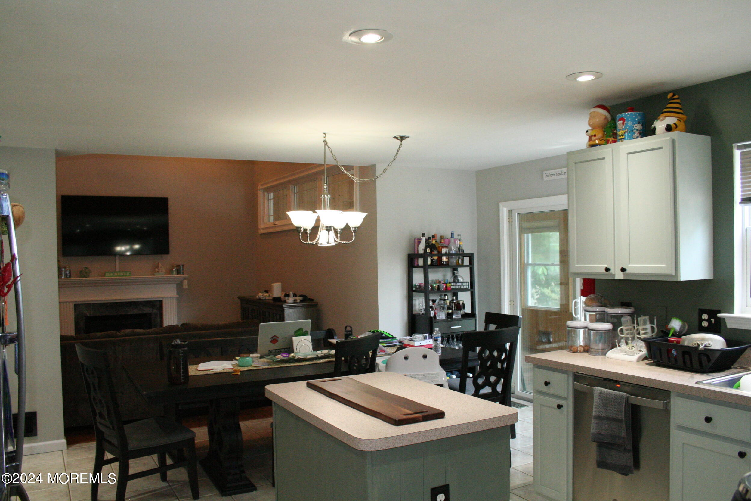 307 Lighthouse Drive Manahawkin, NJ 08050 - Photo 18 of 47 a kitchen that has a sink a stove and chairs