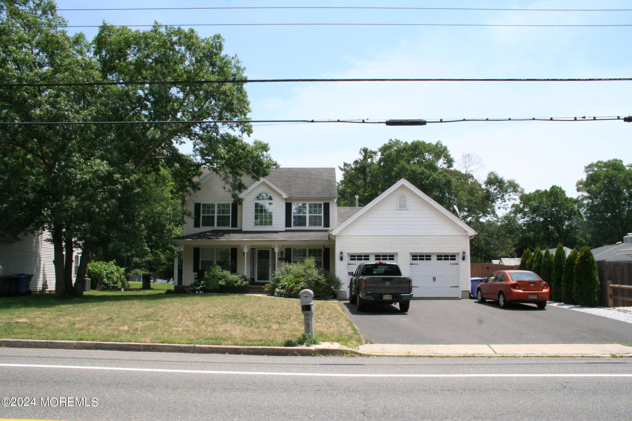 307 Lighthouse Drive Manahawkin, NJ 08050 - Photo 2 of 47 a view of house with a yard and parking space