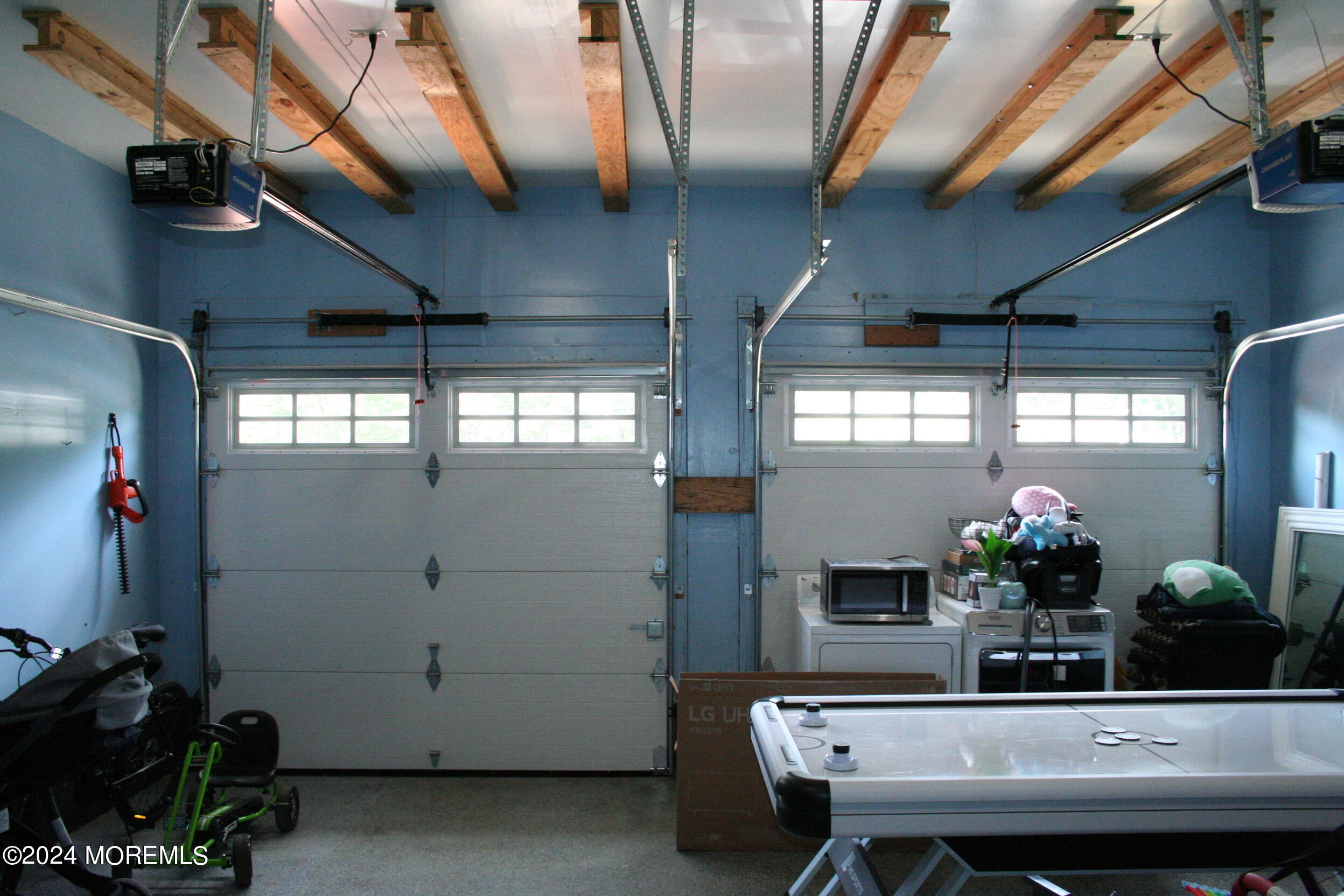 307 Lighthouse Drive Manahawkin, NJ 08050 - Photo 24 of 47 a dining room with furniture and a chandelier