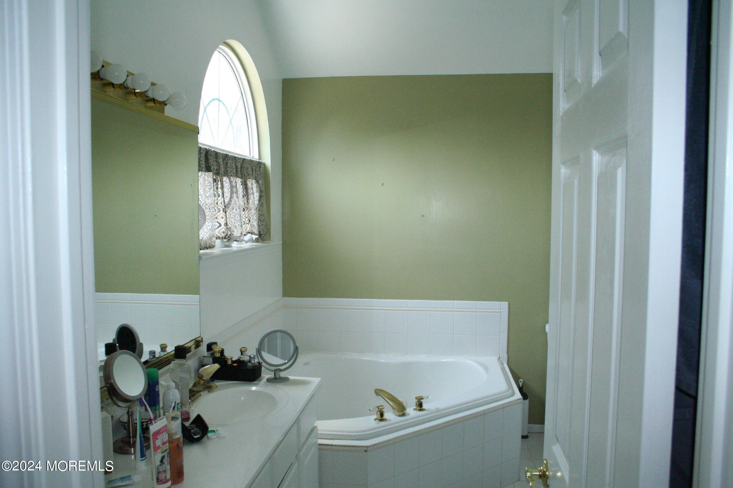 307 Lighthouse Drive Manahawkin, NJ 08050 - Photo 27 of 47 a bathroom with a sink and a bathtub