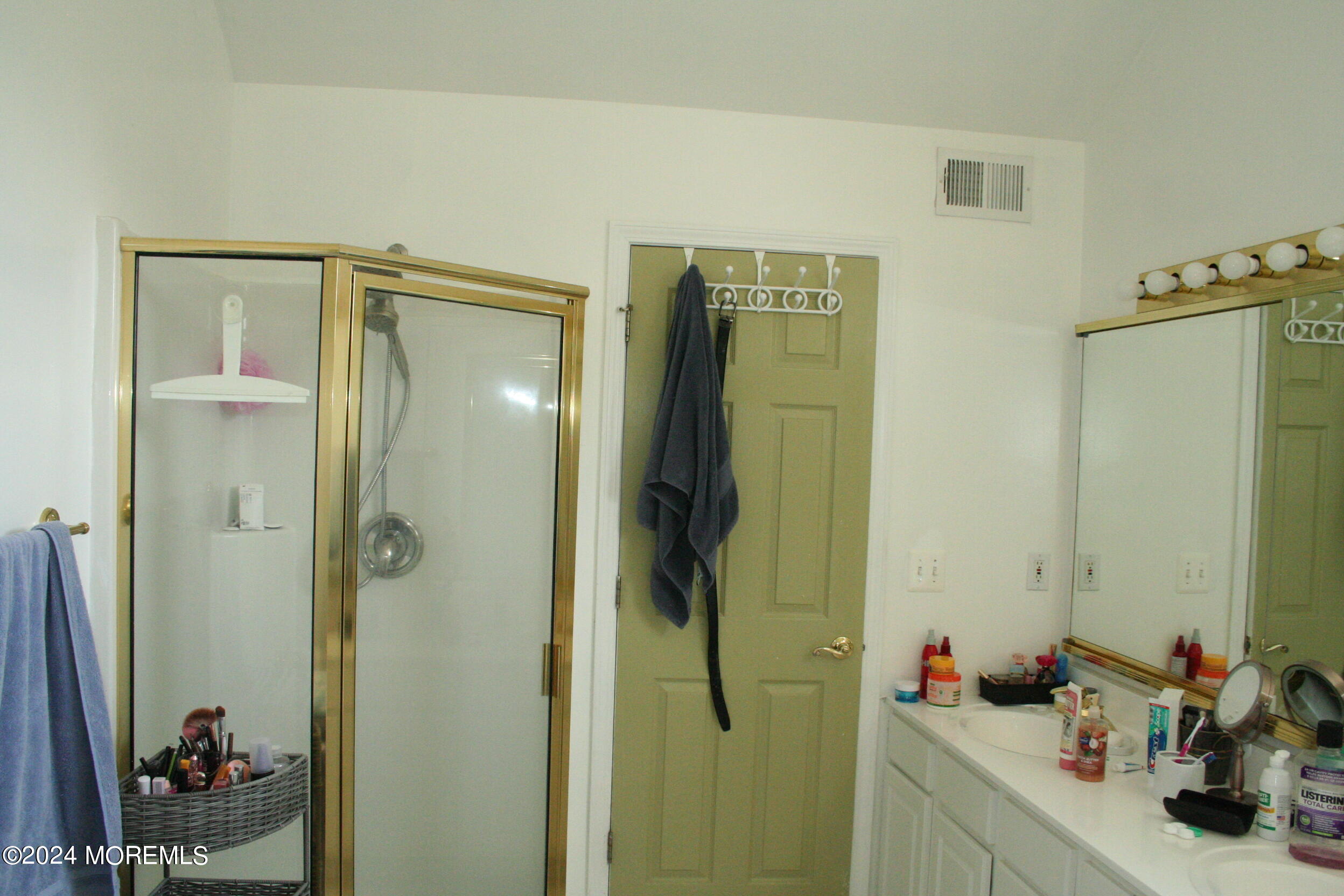 307 Lighthouse Drive Manahawkin, NJ 08050 - Photo 28 of 47 a bathroom with a shower sink and mirror