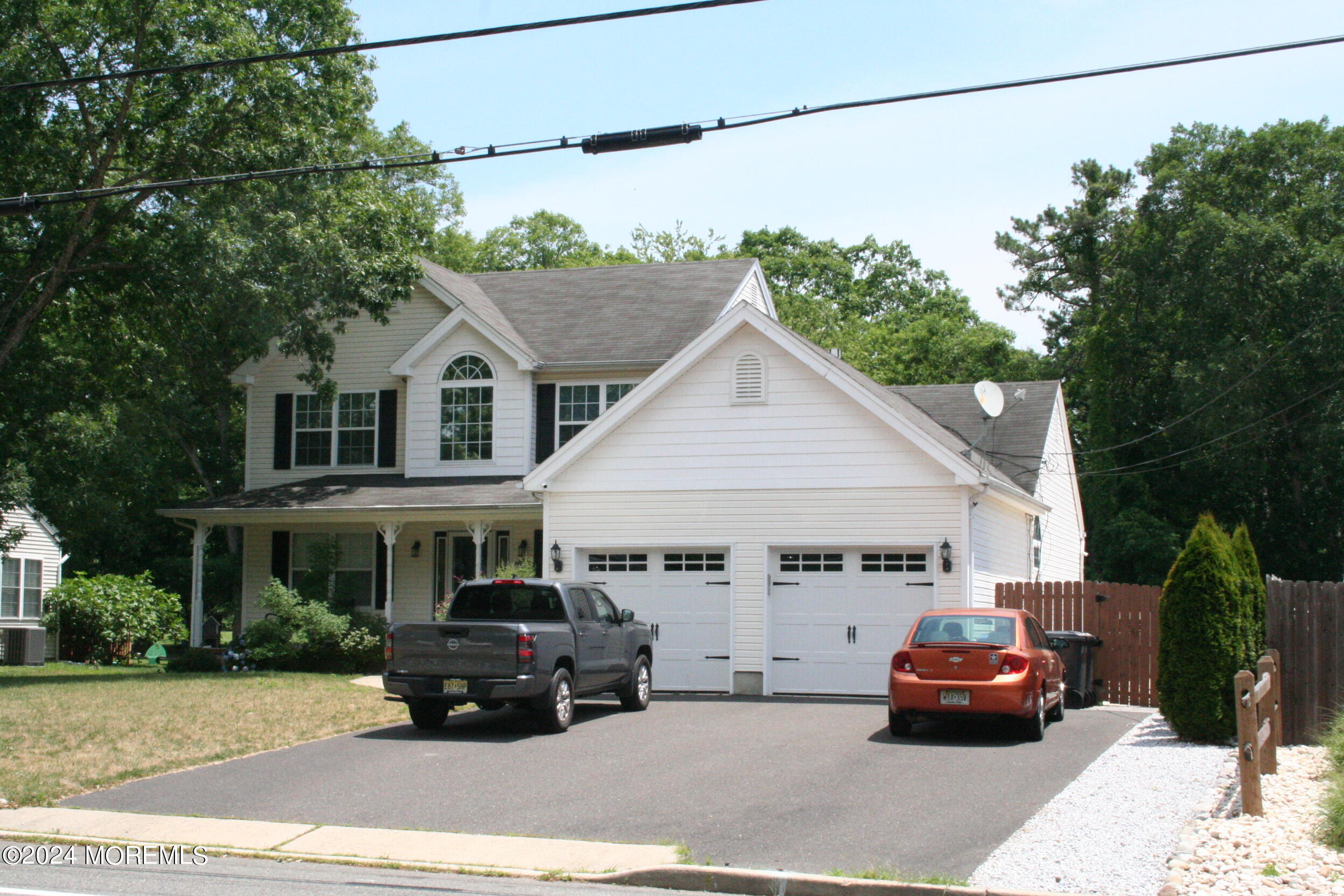 307 Lighthouse Drive Manahawkin, NJ 08050 - Photo 3 of 47 a car parked in front of a house