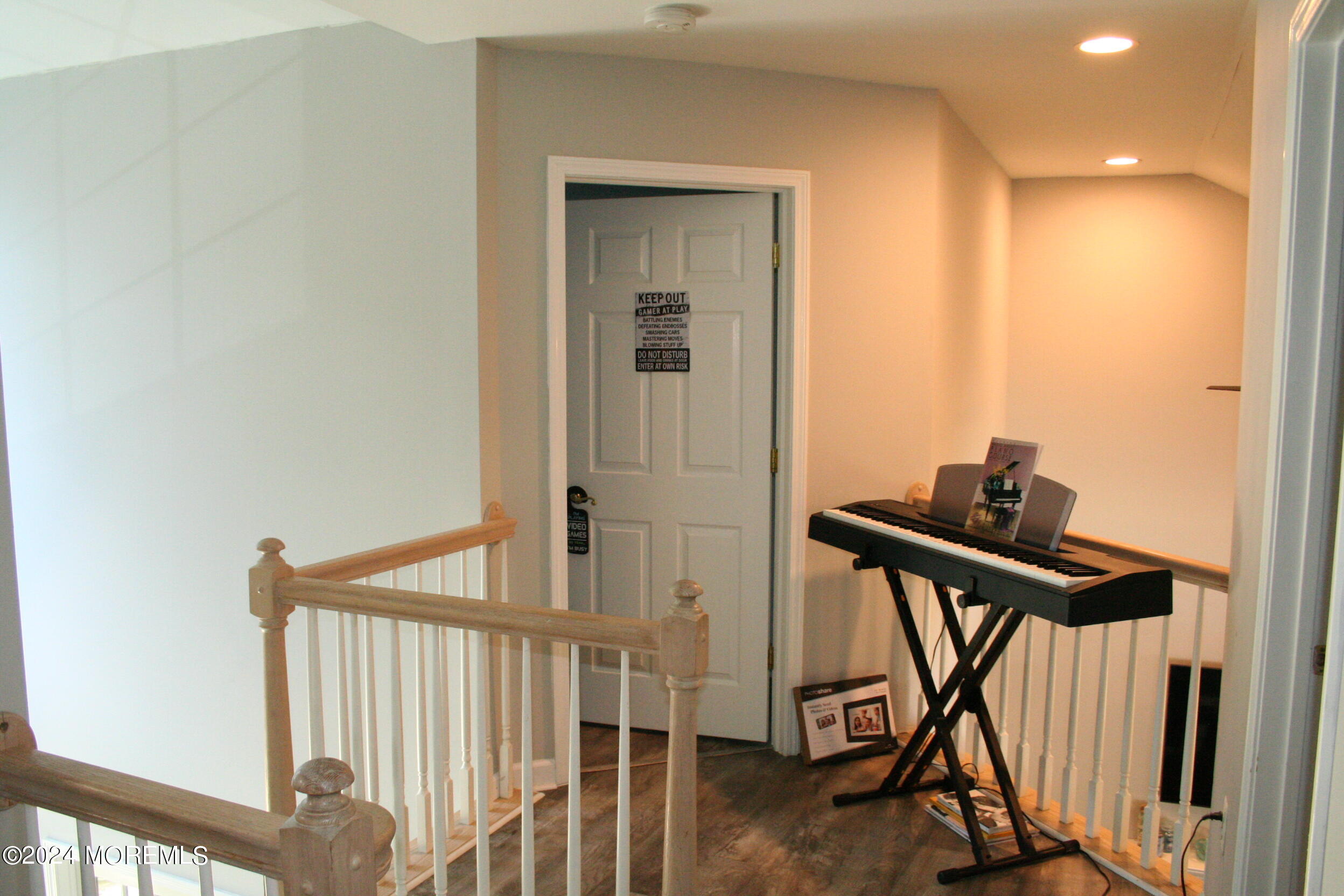 307 Lighthouse Drive Manahawkin, NJ 08050 - Photo 33 of 47 a view of a hallway with wooden floor