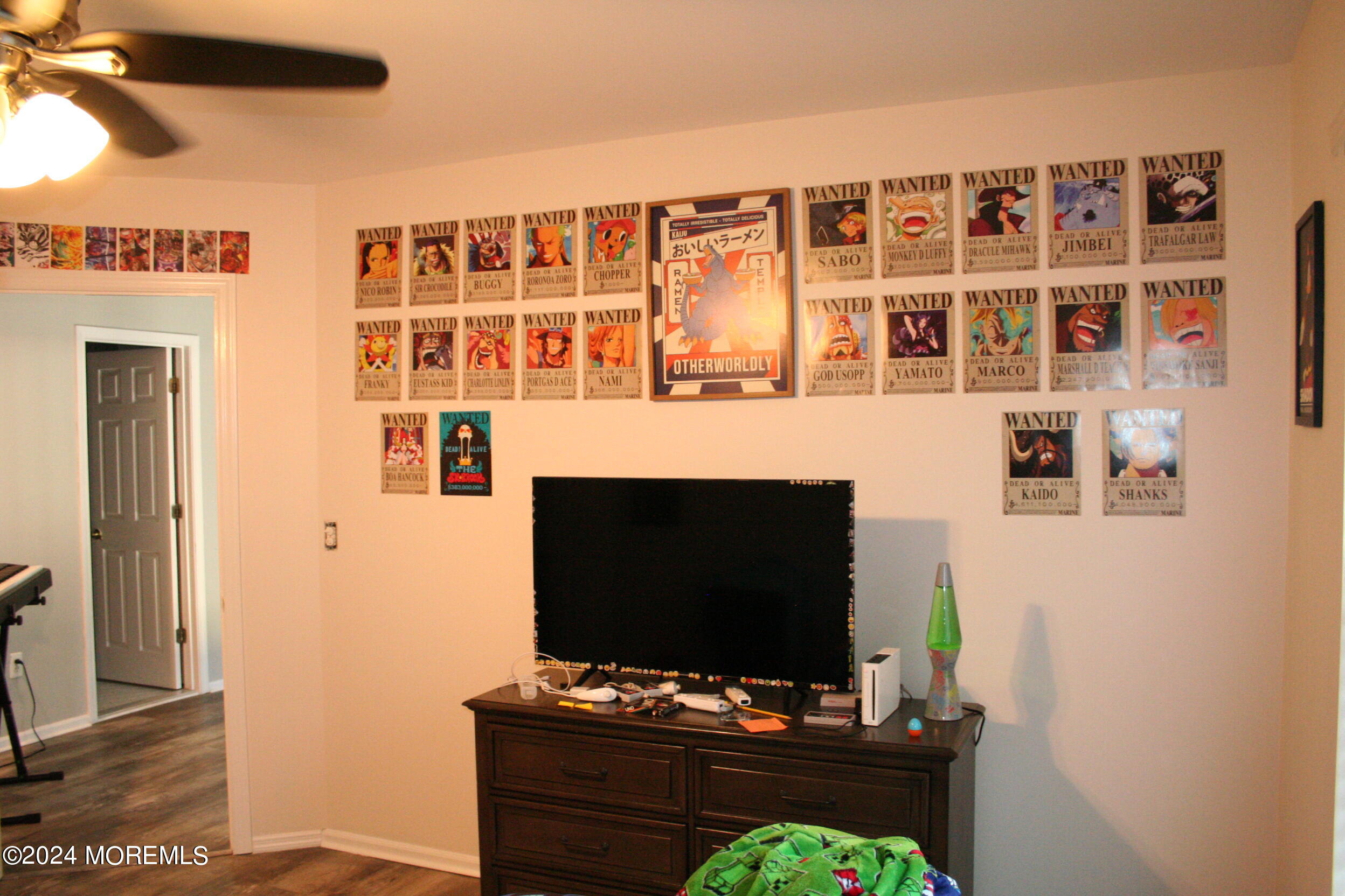 307 Lighthouse Drive Manahawkin, NJ 08050 - Photo 35 of 47 a living room with a flat screen tv and a fireplace