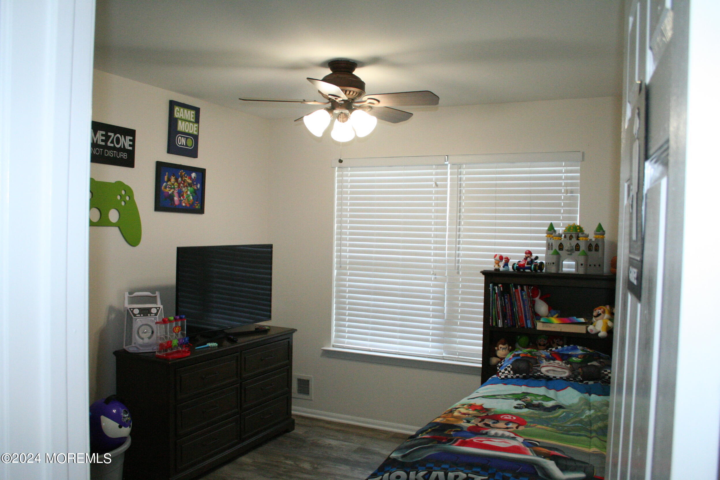 307 Lighthouse Drive Manahawkin, NJ 08050 - Photo 36 of 47 a living room with furniture and a flat screen tv