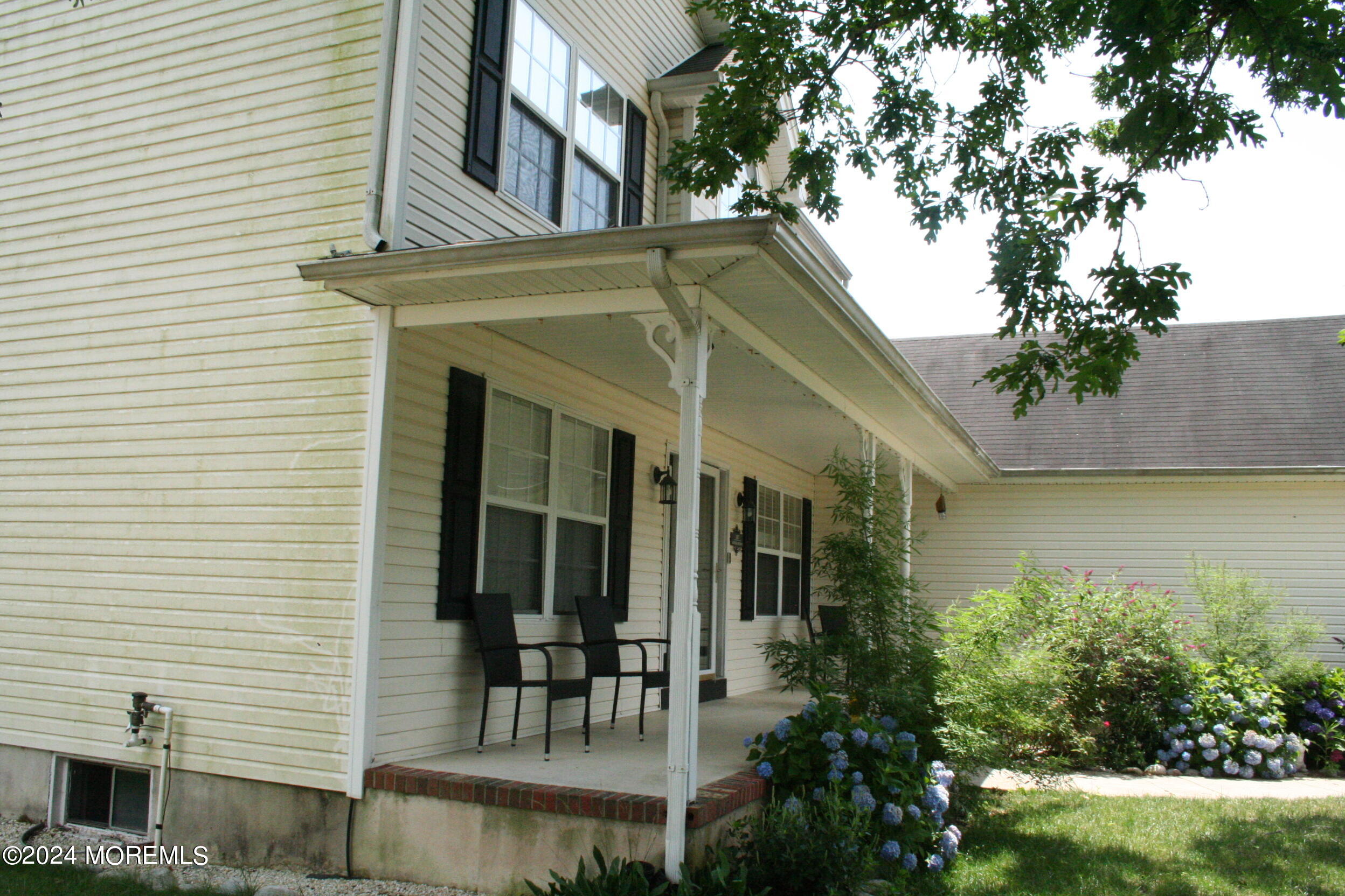 307 Lighthouse Drive Manahawkin, NJ 08050 - Photo 5 of 47 a view of a chair and table in the balcony