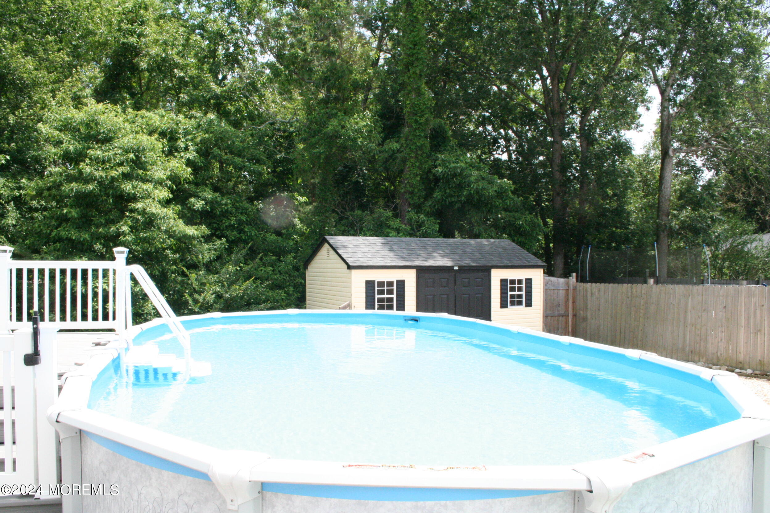 307 Lighthouse Drive Manahawkin, NJ 08050 - Photo 6 of 47 a house with trees in the background