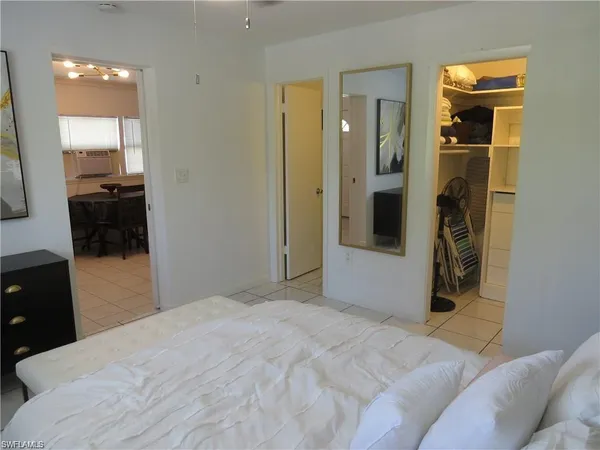 a bedroom with a bed and a view of bathroom