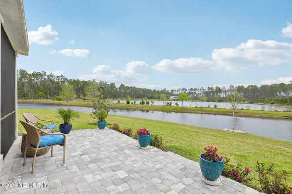 a view of a lake with houses in the back