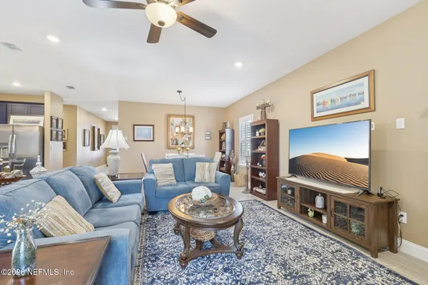 a living room with furniture and a flat screen tv