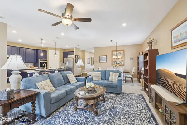 a living room with furniture and a rug