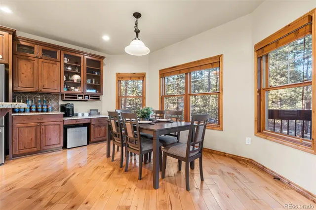 a view of a dining room with furniture window and wooden floor