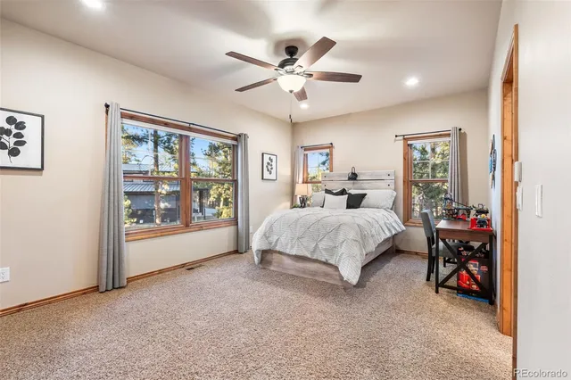 a bed room with a bed and a window