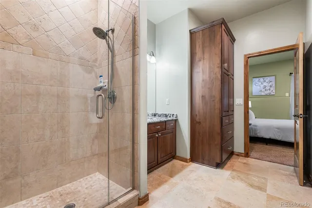 a bathroom with a shower and a sink